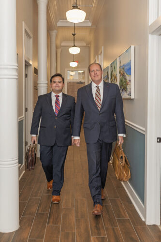 Lawyers walking down hallway
